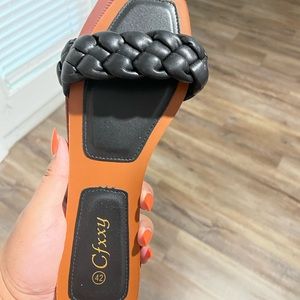 Flat braided leather sandals